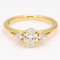 Francine oval and round-cut white diamond three-stone engagement ring