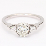 Daria oval and tapered baguette-cut white diamond three-stone engagement ring