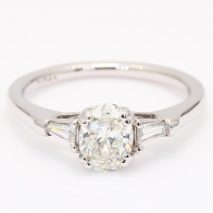 Daria oval and tapered baguette cut white diamond 3 stone engagment ring