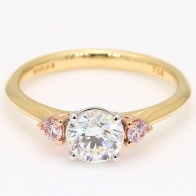 Luminous Argyle pink and white round cut diamond three stone engagement ring