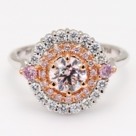 The Triumph Crescendo Exhibition Argyle pink diamond round cut halo ring