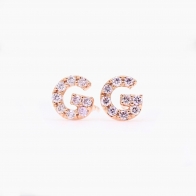 Love Letter G fancy purple diamond stud earrings