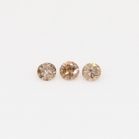 0.15 Total carat trio of round-cut champagne diamonds