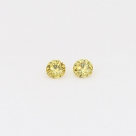 0.10 Total carat pair of round cut yellow diamonds