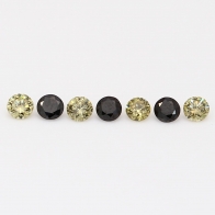 0.28 Total carat parcel of round cut green and black diamonds