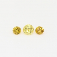 0.16 Total carat trio of round-cut orange and yellow diamonds