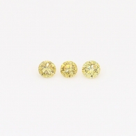 0.12 Total carat trio of round-cut fancy green diamonds