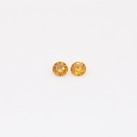0.04 Total carat pair of round-cut fancy orange diamonds