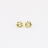 0.10 Total carat pair of round-cut fancy yellow diamonds