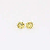 0.10 Total carat pair of round-cut fancy green diamonds