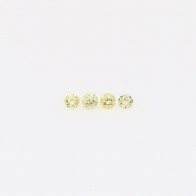 0.04 Total carat parcel of round-cut fancy yellow diamonds