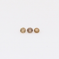0.05 Total carat trio of round-cut champagne diamonds
