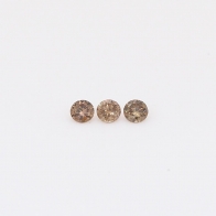 0.06 Total carat trio of round-cut champagne diamonds