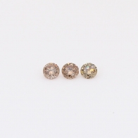 0.10 Total carat trio of round-cut champagne diamonds