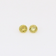 0.12 Total carat pair of round-cut fancy green diamonds