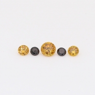 0.16 Total carat parcel of round-cut orange and black diamonds