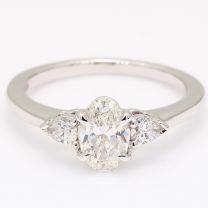 Cortina oval and pear cut white diamond three stone engagement ring