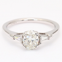 Daria oval and tapered baguette-cut white diamond three-stone engagement ring