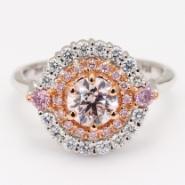 The Triumph Crescendo Exhibition Argyle pink diamond round cut halo ring