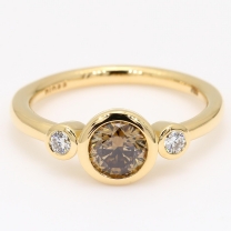 Equinox champagne and white diamond bezel three stone ring