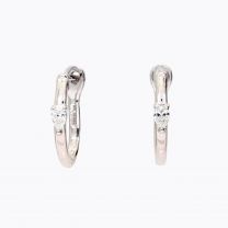 Figure pear cut white diamond huggie earrings