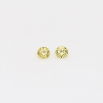 0.06 Total carat pair of round cut yellow diamonds