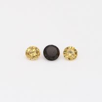 0.19 Total carat trio of round cut yellow and black diamonds