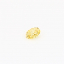 0.19 Carat oval cut orange yellow diamond