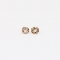 0.08 Total carat pair of round-cut champagne diamond