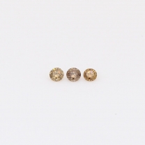 0.05 Total carat trio of round-cut champagne diamonds
