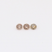 0.10 Total carat trio of round-cut champagne diamonds
