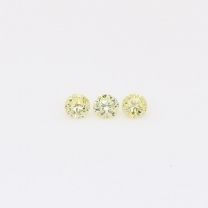 0.105 Total carat trio of round-cut fancy yellow diamonds