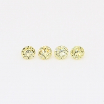 0.20 Total carat parcel of round-cut fancy yellow diamonds