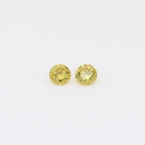 0.12 Total carat pair of round-cut fancy green diamonds