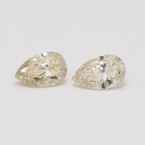 0.81 Total carat pair of pear cut light champagne diamonds