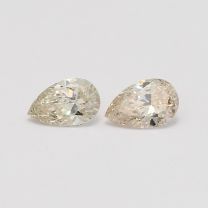 0.76 Total carat pair of pear cut light champagne diamonds