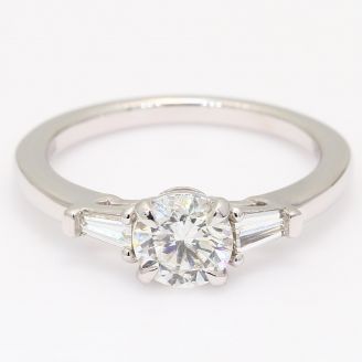 Daria round and tapered baguette-cut white diamond three-stone engagment ring