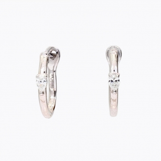 Figure pear cut white diamond huggie earrings