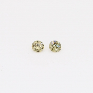 0.08 Total carat weight pair of round-cut fancy green diamonds