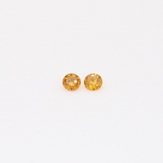 0.04 Total carat pair of round-cut fancy orange diamonds