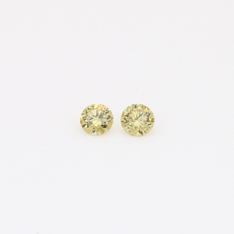 0.10 Total carat pair of round-cut fancy yellow diamonds