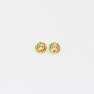 0.06 Total carat pair of round-cut fancy yellow diamonds