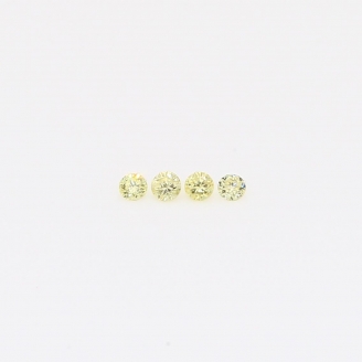 0.04 Total carat parcel of round-cut fancy yellow diamonds