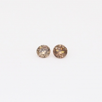 0.10 Total carat pair of round-cut champagne diamonds