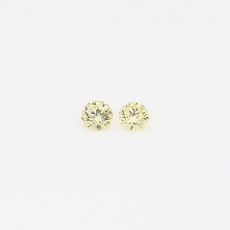 0.09 Total carat pair of round-cut fancy intense yellow diamonds