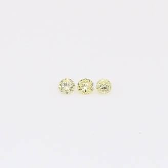 0.06 total carat trio of round-cut fancy yellow diamond