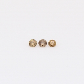 0.05 Total carat trio of round-cut champagne diamonds