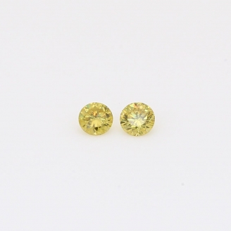0.12 Total carat pair of round-cut fancy green diamonds