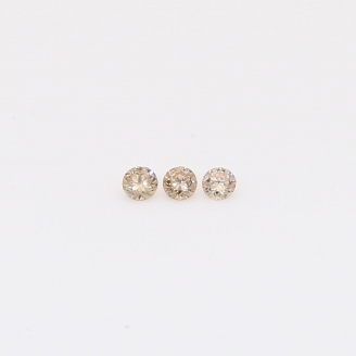 0.03 Total carat trio of champagne diamonds